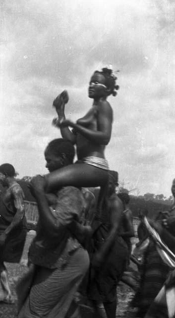 Girl being carried to Sande bush school