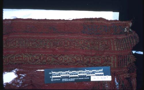 Organic, textile fragment, warp-patterned, red, gold, and dark blue