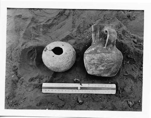 Photo of Pot 3, Burial I; and pitcher from square B2