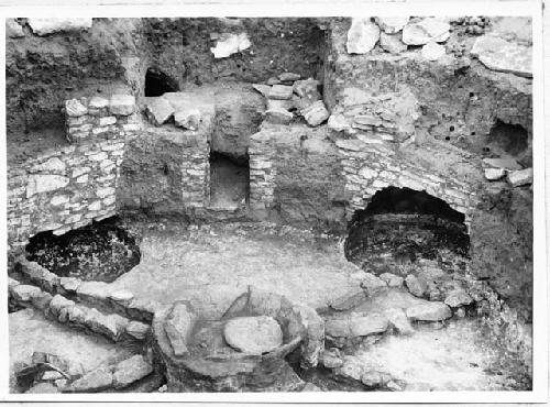 Photo of Kiva, completely excavated, showing cists