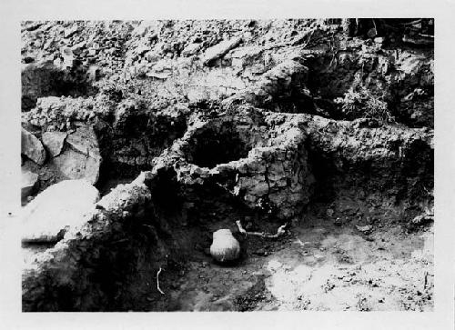 Room 99A, Bin in N.W. corner and banded-neck jar which was found in the bin