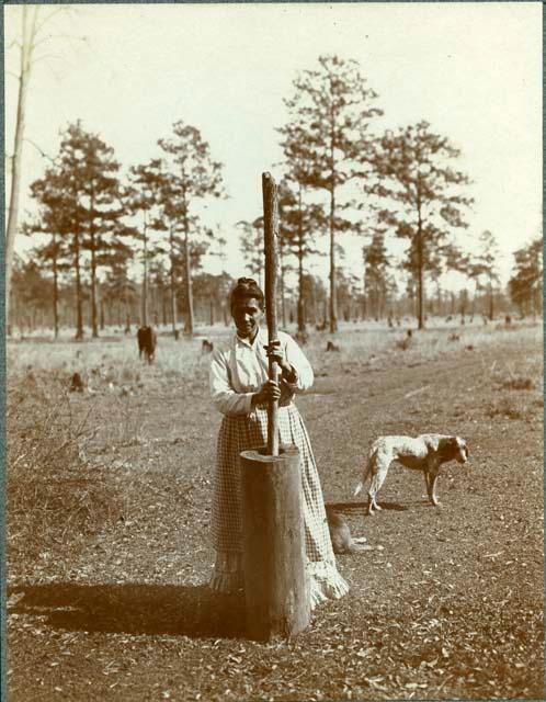 Pounding Corn in Wooden Mortar. Emma. PIS-SAT UN-TAY-MER at Bayou Lacombe, Louisiana