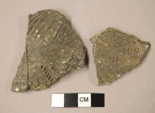 Ceramic rim and body sherds, incised designs, one sherd mended