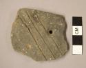 Ceramic rim sherd, one perforation, three incised diagonal lines