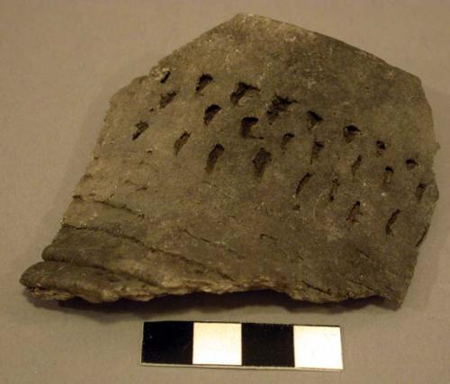 Part of corrugated jar, corrugations partially obliterated