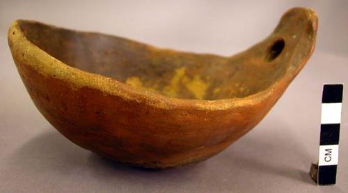 Red pottery ladle