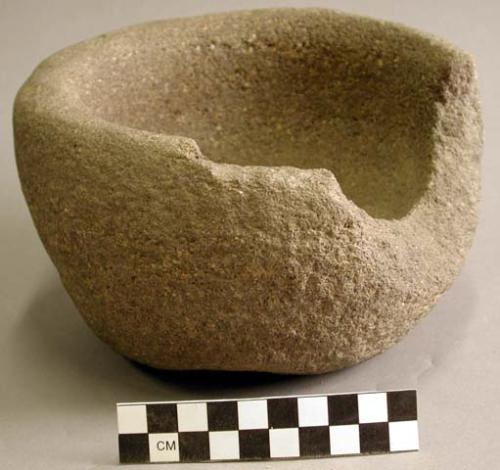 Hard, medium-grained yellow sandstone mortar