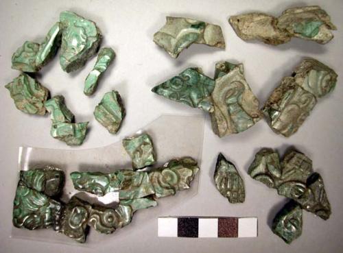 Fragments of carved jadeite, showing face