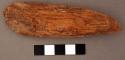 Piece of ironwood, spatulate, coming to blunt point at other end. l: 11.2 cm.