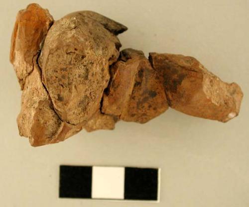 Fragment of clay figurine