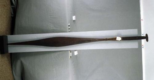 Paddle made of yew wood. Blackened with pitch fire and oil. Kelp padded gunnel