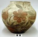 Pottery olla. Globular, red base, cream slip with red and brown designs