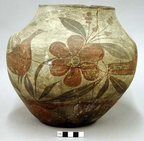 Pottery olla. Globular, red base, cream slip with red and brown designs