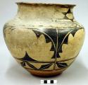 Pottery olla. Cream slip with geometric design in black, red base