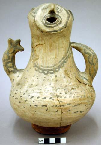 Pottery vessel, grotesque human form.