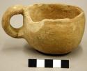Cup, single handle (repaired), chipped rim - gila plain - 5.9 x 8.5 cm.