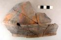 Ceramic rim sherd, incised decoration around rim, mended, plastic display piece