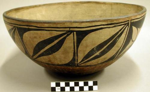 Bowl. One broad band of black on cream design around bowl at rim