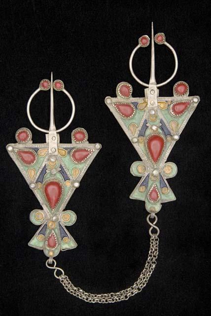 Pair of silver dress ornaments