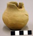 Jar. miniature. shouldered: medial with wide mouth & low neck. rim chipped; body