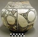 Polychrome jar. Very rounded body w/ slight shoulder and long tapering neck