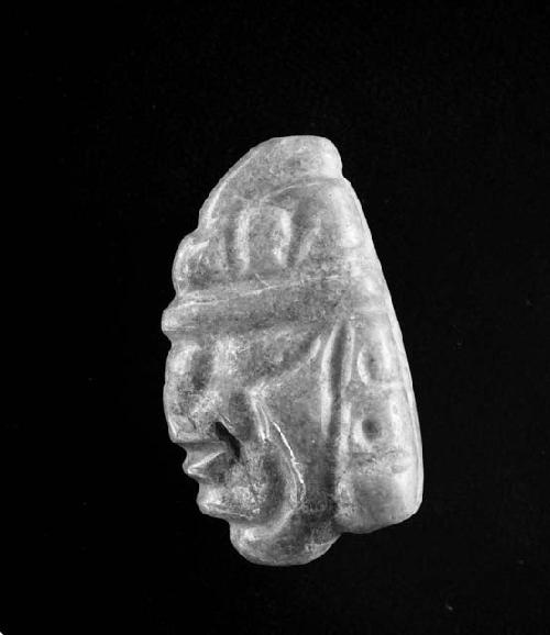 Carved jadeite ornament, human face