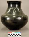 Large black pottery olla. Bear clear design near rim on neck.