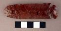 Chipped implement; chipped from red and black mottled obsidian