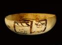 Black on yellow pottery bowl--restored