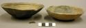 Ceramic bowls, shallow, applied lip and flat base, fireclouded, sherd