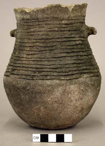 Ceramic jar, complete, corrugated, two lug handles, flat base