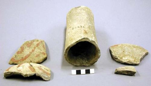 Ceramic sherds, body and rim fragments of a red painted vessel