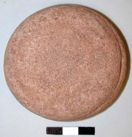 Possible smoothing stone; small discoidal cobble; sandstone; 7.2 x 7.0 x 3.0 cm.