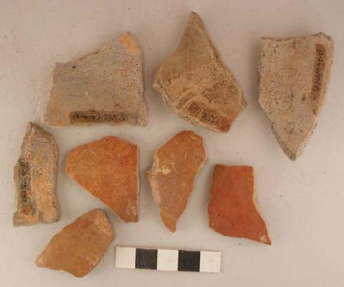 Ceramic body and base sherds, reddish color exterior, some incised