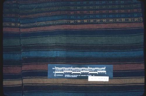 Textile, warp-patterned