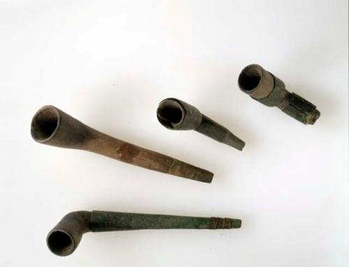 Terracotta pipe with copper bands.