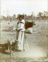 Carrying-Basket in Unusual Position. Louisa. HAY-La Ema with Basket at Bayou Lacombe, Louisiana