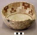 Ceramic bowl, brown on white interior, steep walls, sherds missing from rim
