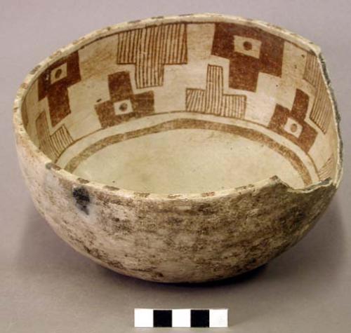 Ceramic bowl, brown on white interior, steep walls, sherds missing from rim