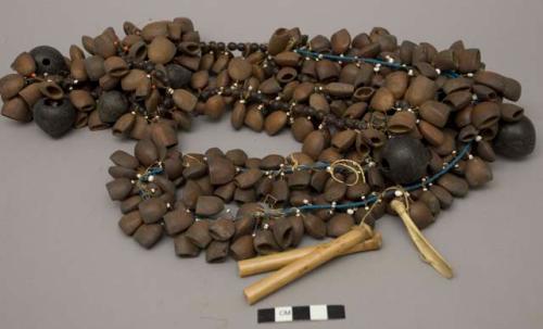 Necklace of seeds, beads, pingulyo reed and turtle bones