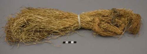 Grass bundles tied on string large enough to fit wrist (patesako)