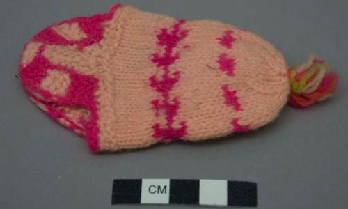 Miniature knitted cap for doll called egego - used in ceremony