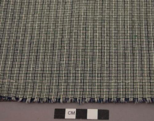 Sample of hand-loomed red, yellow, green, blue and white cloth - basket weave