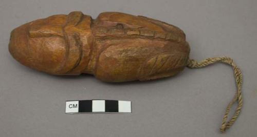 Carved wooden sculpture of animal figure