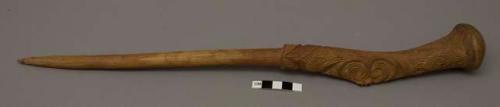 Wooden implement, carved handle: wearing peg