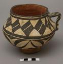 Vessel with applied handle and foot