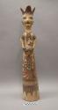 Ceramic "queen" figurine holding a bird
