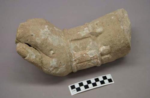 Ground stone hand with portion of lower arm