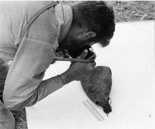 Daniel Blitz photographing a bag