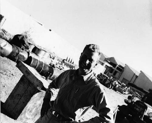 Daniel Blitz standing, with buildings in the background